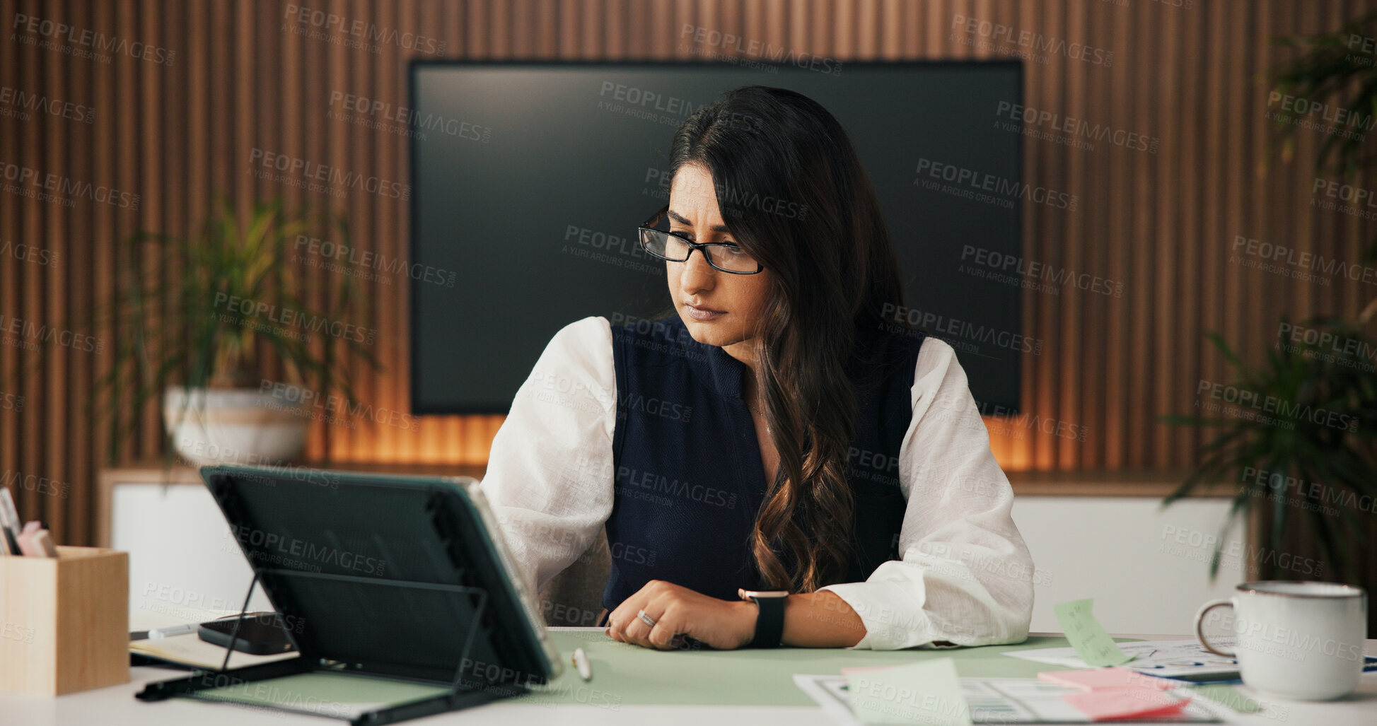 Buy stock photo Serious, tablet and woman in office, investor or email for fraud alert, fail audit report or app. Person, payroll mistake or financial advisor in workplace, tech or online reading for trade review