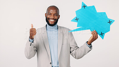 Buy stock photo Black man, portrait and speech bubble with thumbs up in studio for business on a white background. Businessman, employee or smile with like emoji, yes sign or icon for social media on mockup space