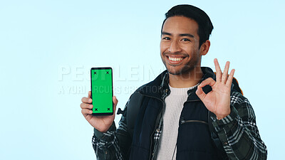 Buy stock photo Green screen, hiker and happy man with phone, portrait and recommendation for social media or travel. Blue background, marketing and person with ok hand gesture for mobile, studio and mockup space