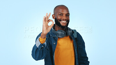 Buy stock photo Studio, student and man with approval sign for scholarship acceptance, entrance exam review or space. Portrait, happy black person and ok emoji on blue background for college success, study and pride