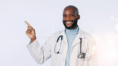 Buy stock photo Pointing, doctor and portrait of black man in studio for medical support, tips or healthcare service. Bokeh, space and person with gesture for information, medicare and wellness on white background