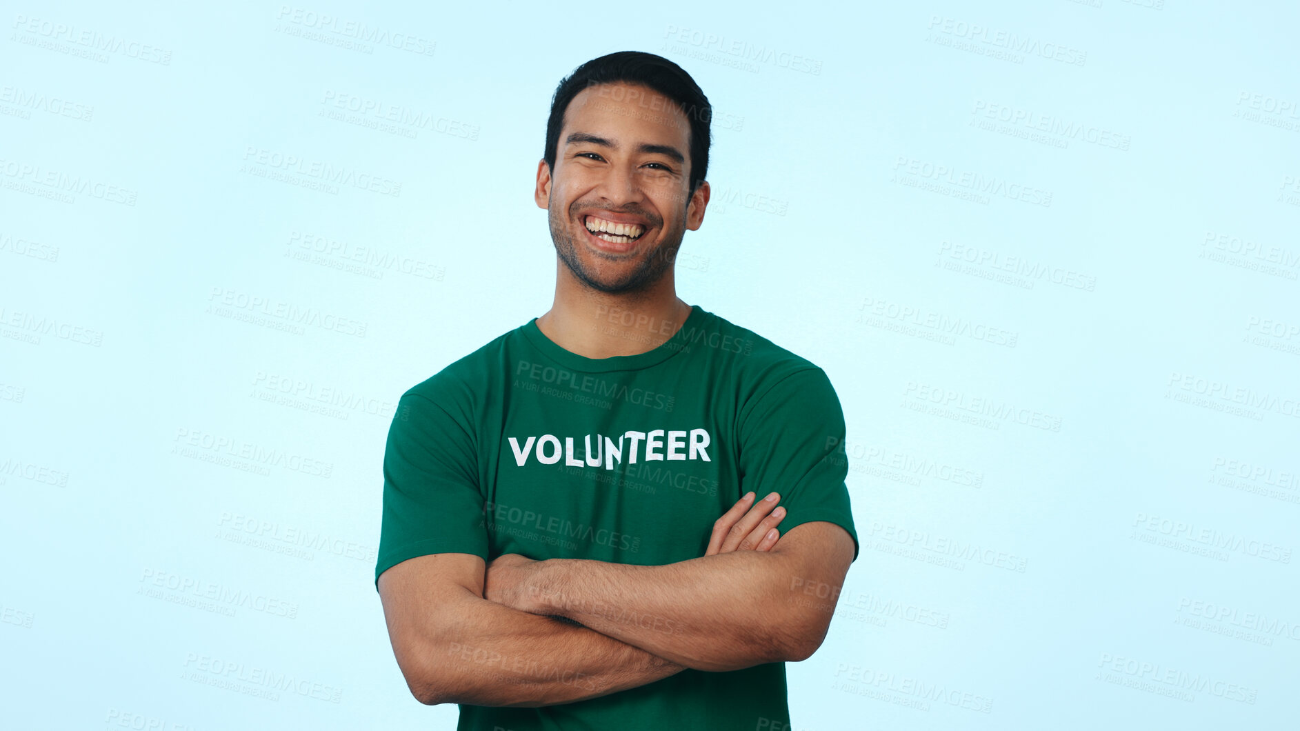Buy stock photo Volunteer, man or happy with arms crossed in studio for earth day NGO, non profit aid or about us. Space, laugh portrait or activist on blue background for community service, charity or green project