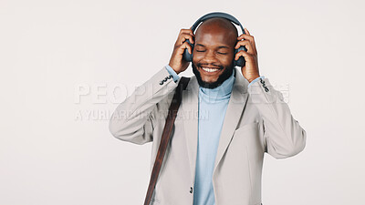 Buy stock photo Music, smile and business with black man in studio for streaming service, audio or professional sound. Radio, song playlist or media subscription with employee or headphones on white background space