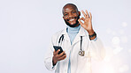 Phone, okay sign and portrait of doctor in studio for medical support, telehealth and health service. Healthcare, space and person for medicine, medicare and online consulting on blue background