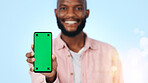 Green screen, presentation and happy man with phone, portrait or recommendation for social media app. Blue background, marketing and black person with smile for mobile, promotion and tech in studio