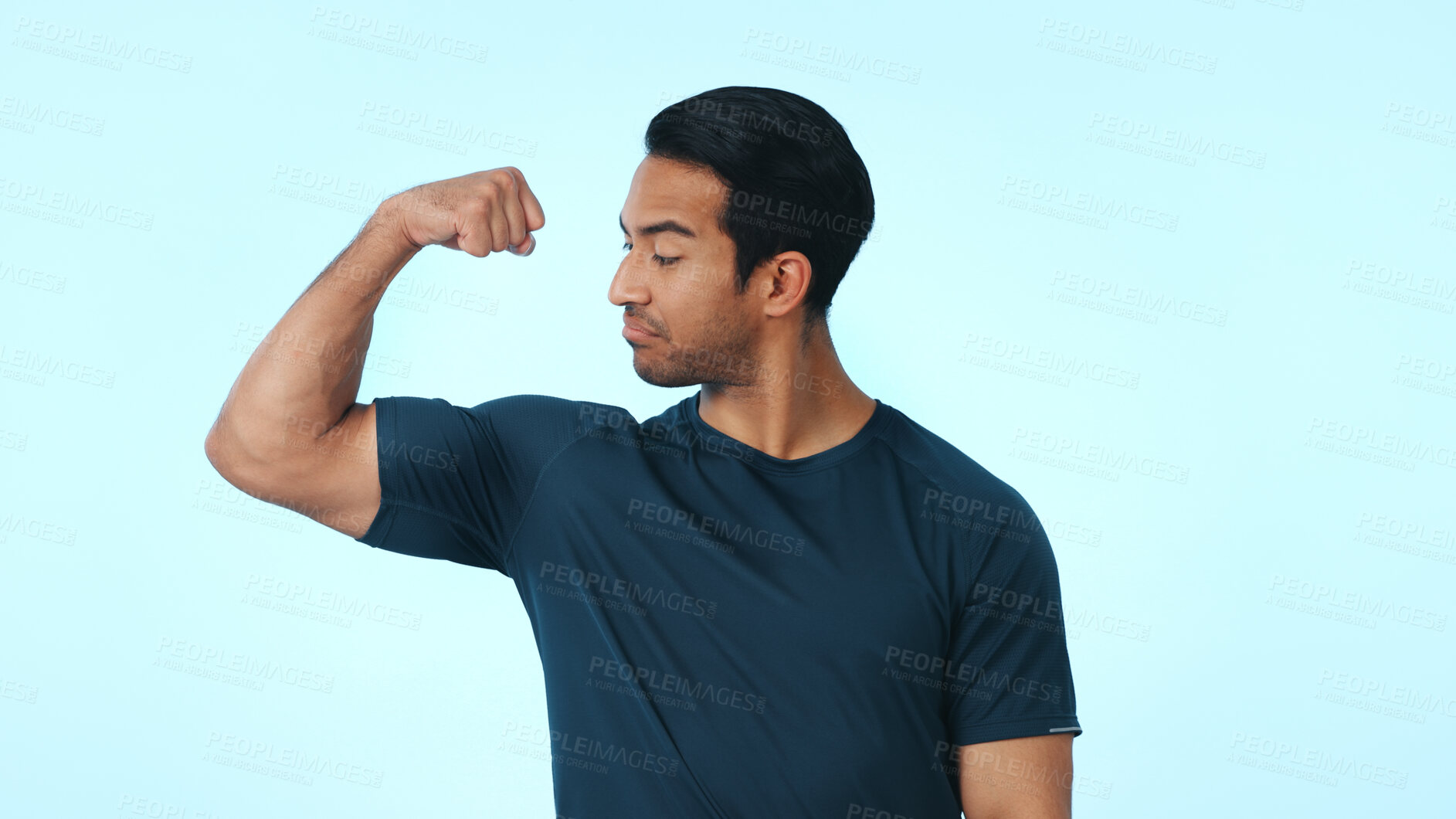 Buy stock photo Fitness, flex and man with muscle in studio with pride for exercise, workout progress or results. Space, mockup and confident person with biceps for health, wellness or bodybuilder on blue background