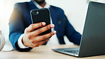 Businessman, hands and phone with laptop for communication, financial advice or networking in office. Person, tech and research with message for client feedback, portfolio review or notification