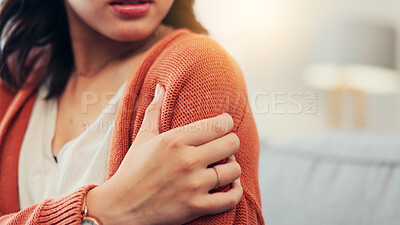 Buy stock photo Shoulder, pain and woman on sofa with injury for fibromyalgia, osteoporosis and inflammation. Home, space and person massage arm for strain, muscle tension and joint ache with pressure in living room