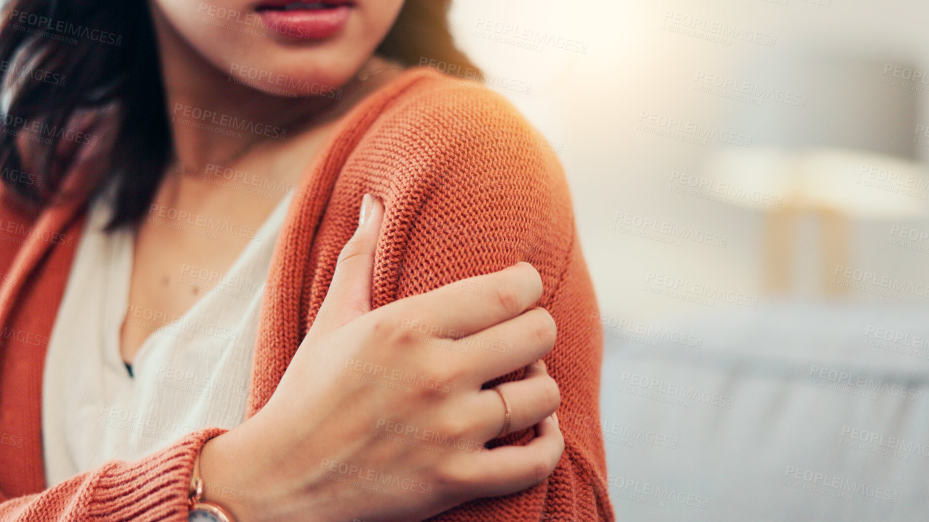 Buy stock photo Shoulder, pain and woman on sofa with injury for fibromyalgia, osteoporosis and inflammation. Home, space and person massage arm for strain, muscle tension and joint ache with pressure in living room