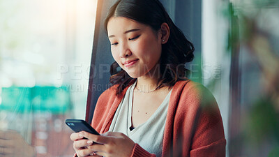 Buy stock photo Happy, typing and Asian woman with phone in home for social media, online chat and notification. Apartment, scroll and person on smartphone for connection, communication and message on mobile app