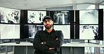 Man, security guard and arms crossed in control room with monitor, glasses and confidence for job. Person, surveillance officer and pride in portrait, screen and crime prevention career in Mexico