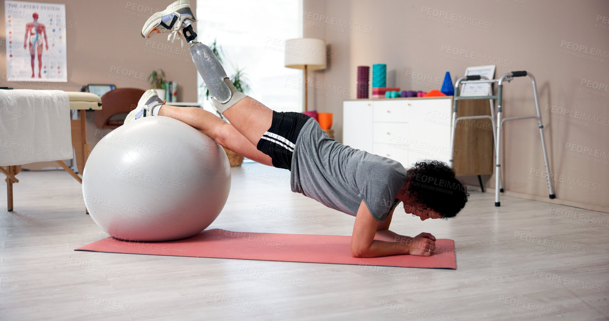 Buy stock photo Prosthetic legs, physiotherapy and woman with ball in clinic for healthcare or exercise. Therapy, recovery or rehabilitation for person with a disability with muscle, balance or treatment for injury