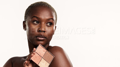 Buy stock photo Black woman, makeup and beauty with palette in studio for skincare cosmetics on a white background. Female person, thinking or skin tone with foundation for cosmetology, glow or shine on mockup space