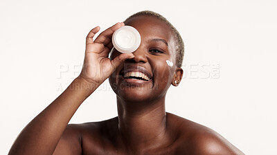 Buy stock photo Portrait, skincare and black woman in studio with face cream, lotion container and antiaging benefits. Person, smile and apply moisturizer for dermatology, wellness or clear skin on white background.