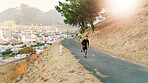 Man, running and training in nature for fitness, leg muscle development and exercise for cardio. Male person, runner and jogging on mountain trail for healthy body, outdoor challenge and wellness