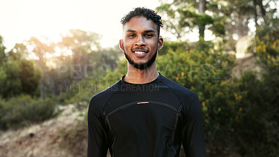 Buy stock photo Happy man, portrait and fitness in nature for outdoor exercise, workout or run in wilderness. Active, male person or runner with smile for physical activity, health or wellness in forest or woods