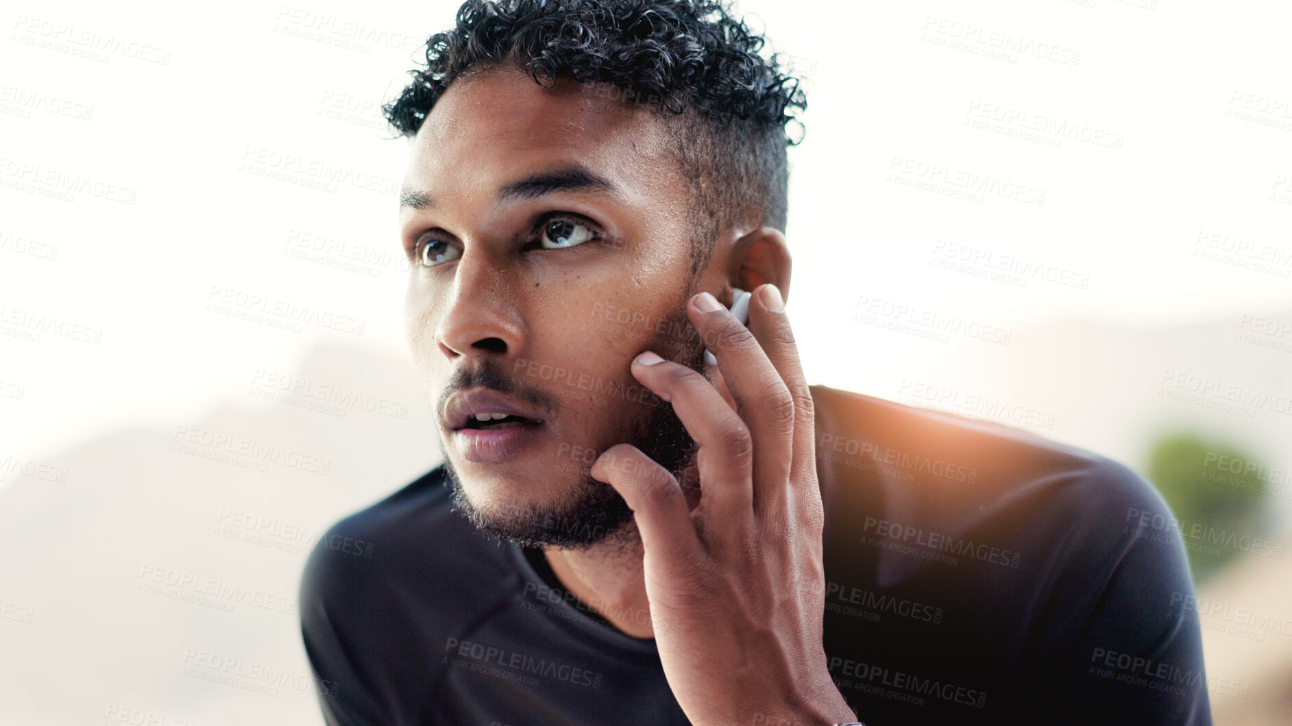 Buy stock photo Earphones, exercise and thinking with man outdoor for start of cardio training or workout routine. Fitness, music and vision with runner in nature for challenge, physical improvement or wellness