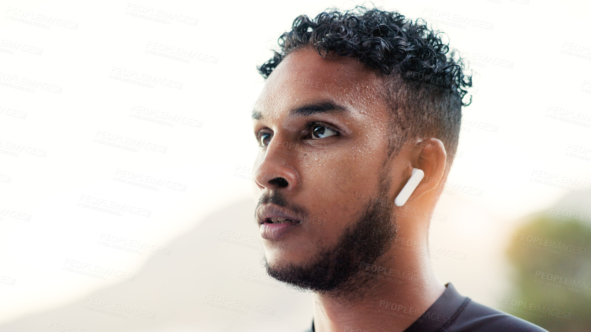 Buy stock photo Fitness, music and vision with man outdoor for start of cardio training or workout routine. Earphones, exercise and thinking with runner in nature for challenge, physical improvement or wellness