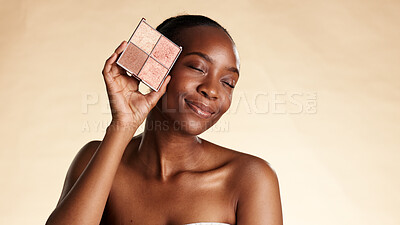 Buy stock photo Smile, makeup and color palette with black woman in studio for cosmetics, powder and glow. Eyeshadow, foundation and space with African person for cosmetology, aesthetic or blush on background
