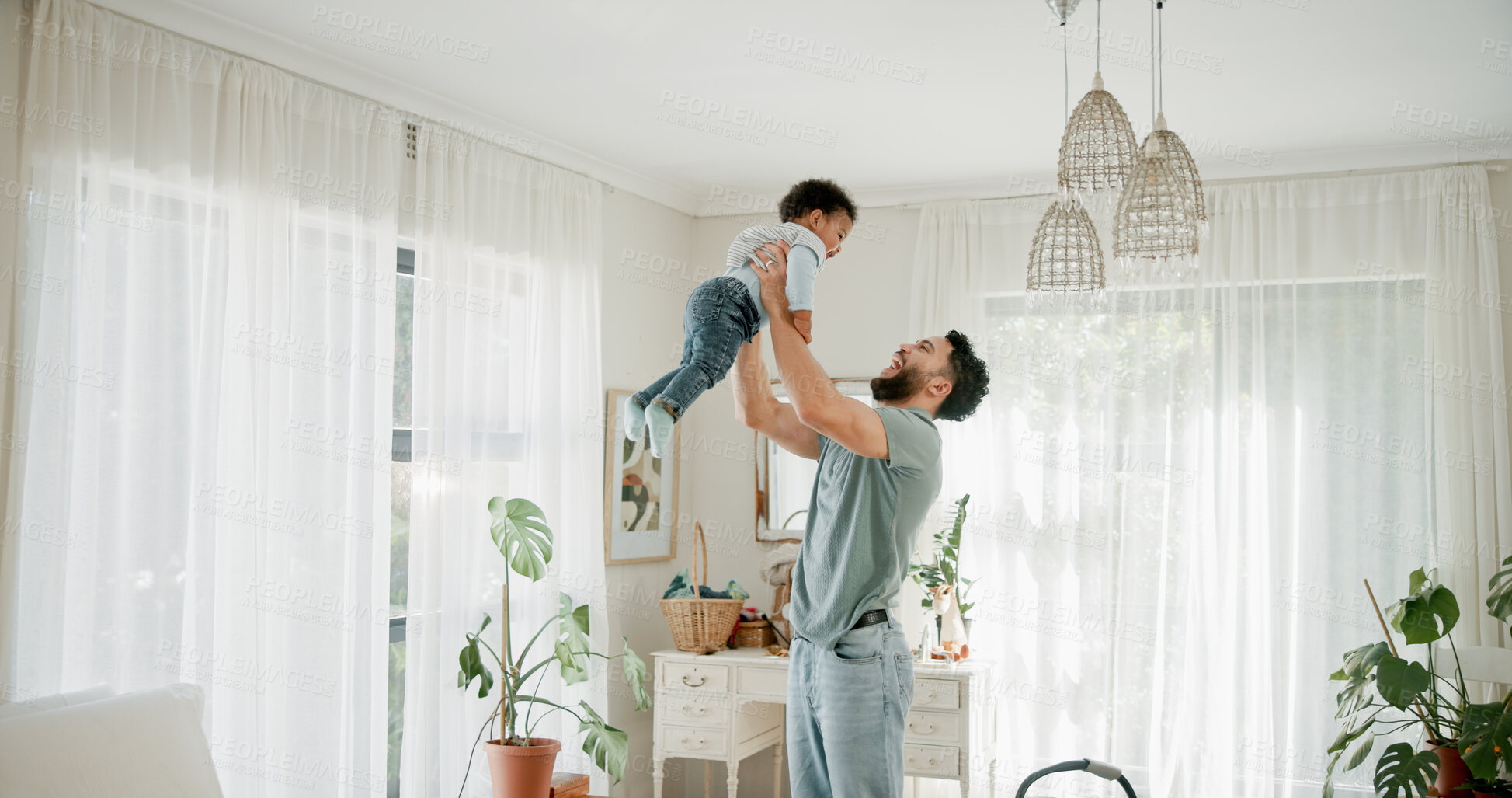 Buy stock photo Family, lift and father in home, baby and bonding together for fun, comfort and happiness. Support, parent and kid in living room, game and laughing with smile, love and care for child development