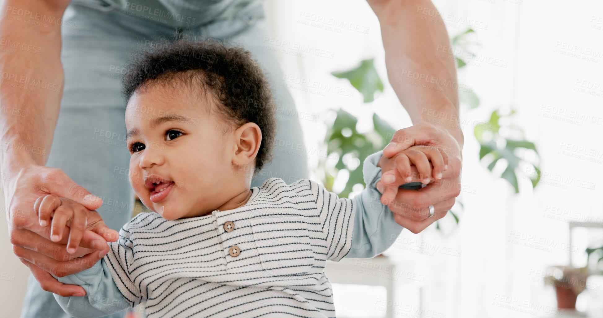 Buy stock photo Holding hands, baby and father teaching to walk, support or mobility development in home. Child, parent and infant with first steps for motor skills, growth or help for learning balance while bonding