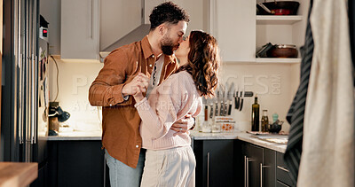Buy stock photo Kiss, dance and couple in kitchen for love, anniversary celebration or bonding with pregnant partner. Moving, woman and man in home with music for romantic rhythm, pregnancy and holding hands
