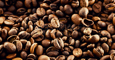 Buy stock photo Closeup, roasted and organic beans for coffee production, textures and sustainable harvest. Granules, arabica grain and manufacturing process of caffeine, beverage extraction and espresso ingredients