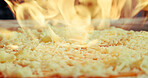 Oven, pizza and baking in restaurant with fire, cheese melting and Italian cuisine for catering service. Flame, meal or flatbread cooking in diner for food preparation, takeaway lunch or hospitality.