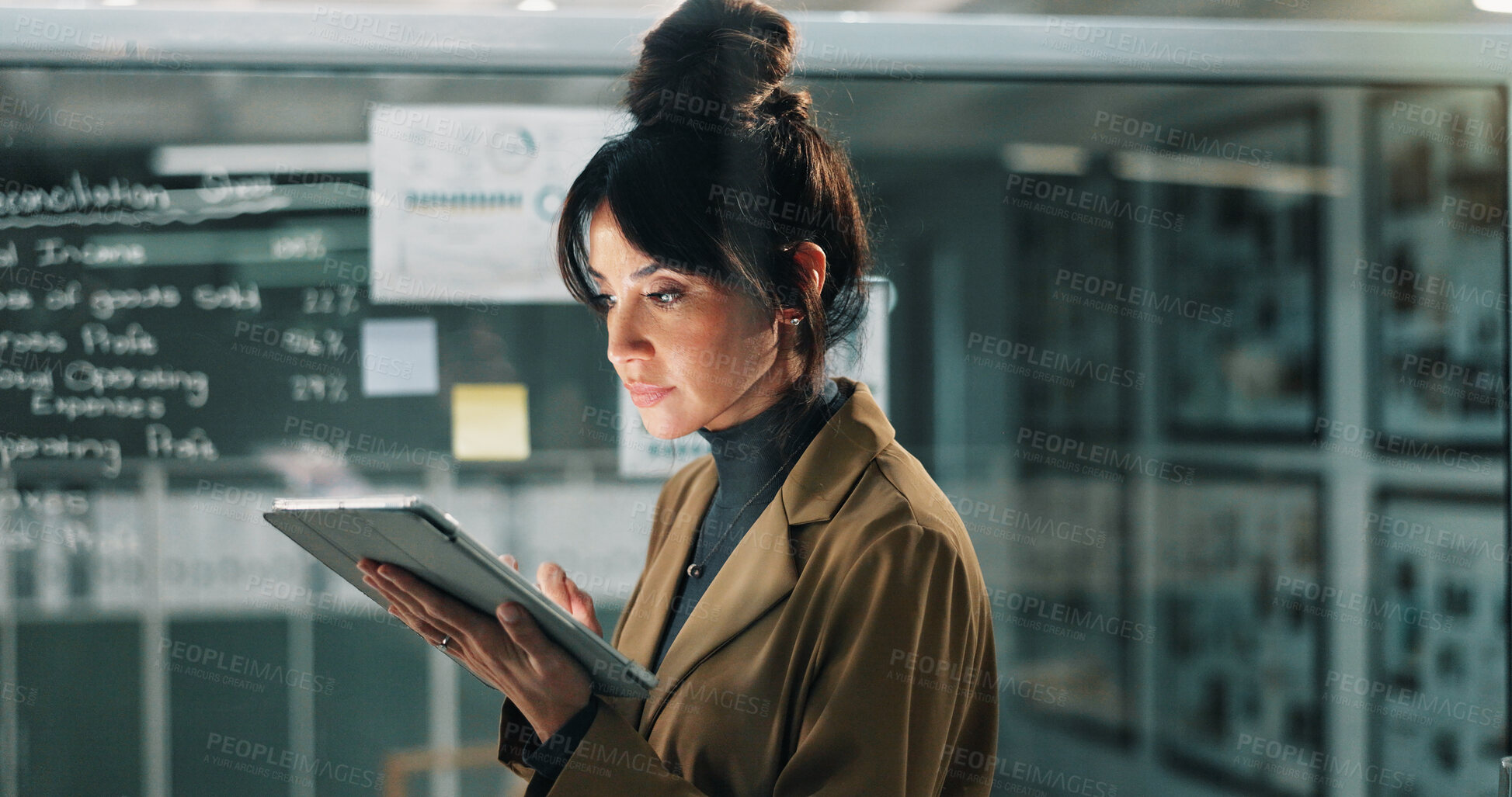 Buy stock photo Business, woman and reading with tablet at night for research, data analysis and finance report. Mature person, review and digital for audit, financial statistics and deadline for investment proposal
