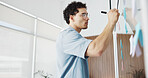Businessman, writing and planning with glass board in office for schedule, tasks or agenda. Creative, man or employee taking notes with marker for brainstorming ideas or project reminder in workplace