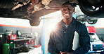 Mechanic, man and workshop portrait with clipboard for car inspection, diagnostic notes or flare. Technician, auto repair and black person with checklist for maintenance, calibration or service quote