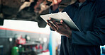 Mechanic, garage and hands with clipboard for car inspection, auto maintenance and damage assessment. Workshop, notes and person with checklist for vehicle repair, quality assurance and motor report