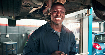Buy stock photo Mechanic, portrait and black man with car in auto repair shop for diagnostic system, transport or calibration. Engineering, maintenance and tablet with happy person in garage for service report
