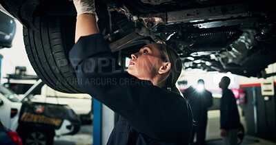 Buy stock photo Woman, mechanic and inspection with car in workshop for automotive repair, fix or diagnostics. Female person, engineer and checking vehicle for road worthy, calibration or motor service in garage