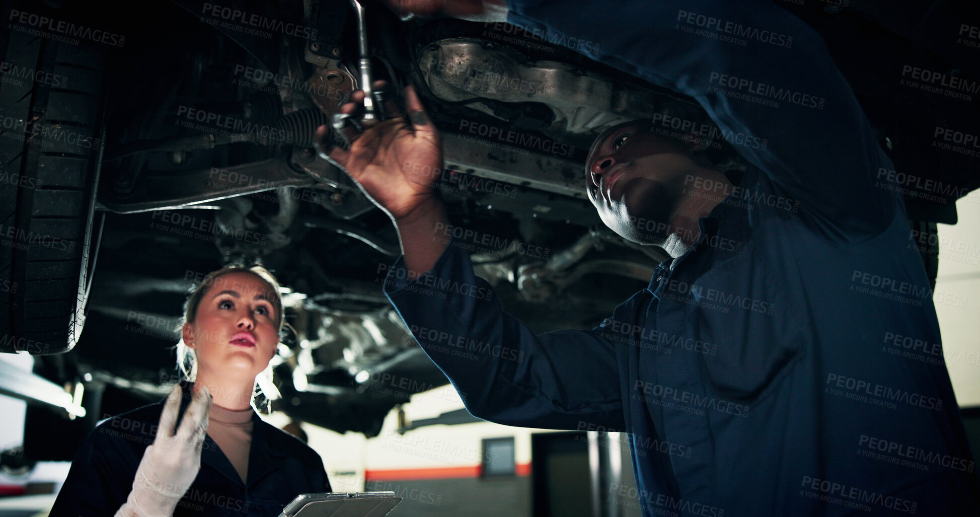 Buy stock photo Mechanic, garage and people with tools by car for diagnostics, maintenance and auto service. Workshop, teamwork and man with woman with equipment for vehicle inspection, fixing and engine repair