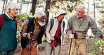 Senior, group and hiking discovery in forest for travel adventure, field research or eco tourism. Voluntary conservation, sticks or old people trekking in woods for expedition, ecology study or trail