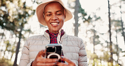 Buy stock photo Hiking, happy and senior woman with phone for wellness, fresh air and online app for navigation. Travel, typing and elderly person on smartphone for direction, health and exercise on nature trail