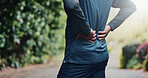 Outdoor, fitness and hands with back pain on break, exhaustion or joint tension with workout injury. Park, exercise and old person with inflammation after training accident, space and muscle strain