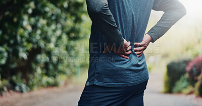 Buy stock photo Outdoor, fitness and hands with back pain on break, exhaustion or joint tension with workout injury. Park, exercise and old person with inflammation after training accident, space and muscle strain