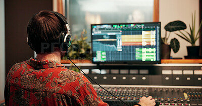 Buy stock photo Computer screen, headphones and music with man in studio for recording or sound engineering. Display, production and synthesizer with DJ person in control room for balance or mixing from back