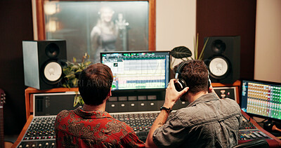 Buy stock photo Sound engineer, screen or team in recording studio with mixing console, headphones or music quality. Collaboration, audio and men editing on computer monitor for volume, creative production and back