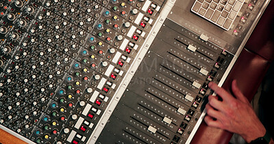 Buy stock photo Person, hands or audio technician with sound board for radio broadcast, live streaming or production. Top view, engineer or podcaster with switches, console or control panel for music mixer or record