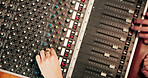 Hands, audio engineer and above with sound board for radio broadcast, live streaming or production. Top view, people or podcaster with switches, console or control panel for music mixer or recording