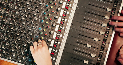 Buy stock photo Hands, audio engineer and above with sound board for radio broadcast, live streaming or production. Top view, people or podcaster with switches, console or control panel for music mixer or recording
