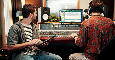 Buy stock photo Sound engineer, tablet and men in recording studio with team for music, composition or song quality. Collaboration, mixing audio or editing with computer screen, creative production and mastering