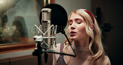 Buy stock photo Creative, woman and singing in recording studio with microphone, song performance and music production. Artist, person and singer at record label with gear, talenr and sound track for album project.