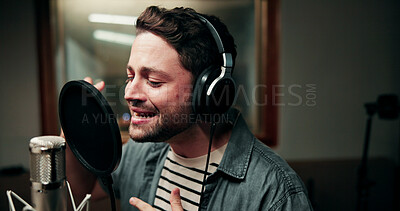 Buy stock photo Singer, microphone and man in studio with headphones, production or musician in performance. Talent, music recording or artist in booth with tech, song or sound entertainment for creative album.