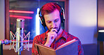 Thinking, book or singer in studio with tech, songwriting or brainstorming in creative production. Reflection, mic or man in booth with headphones, melody writing or album ideas in music development.