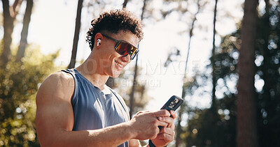 Buy stock photo Fitness, happy and man in nature with phone for social media after training, exercise and workout. Sports, athlete and person on smartphone for health app, internet and online chat outdoor