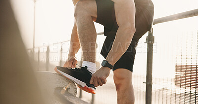 Buy stock photo Hands, shoelace and man in city, fitness for wellness and comfort for footwear, sunshine and exercise. Outdoor, athlete and person with sneakers, practice and training with challenge and start day